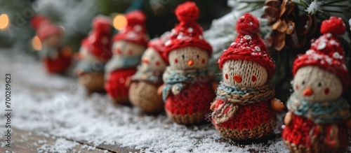 Christmas figurines with knitted red hats that are amusing and crafted by hand.