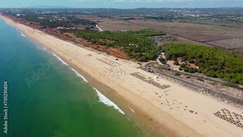 Aerial drone point of view of Falesia Beach. Situated in south of Portugal, Algarve region a famous travel destination. Golden mile beach. Drone forward. Panoramic view of all region