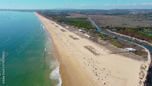 Aerial drone point of view of Falesia Beach. Situated in south of Portugal, Algarve region a famous travel destination. Virgin golden mile beach. Drone forward. Panoramic view of all region