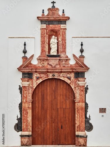 Wooden door of a Church. Victiria Church. Écija, Seville, Andalusia, Spain photo