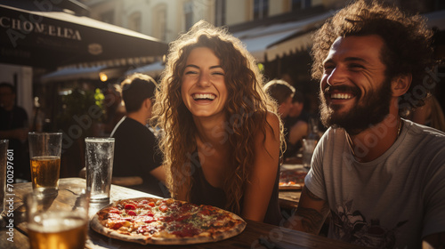 Relaxed friends sitting at table at party. Young people in casual clothes sitting on terrace roof  talking  eating pizza and drinking wine. Communication  friendship concept