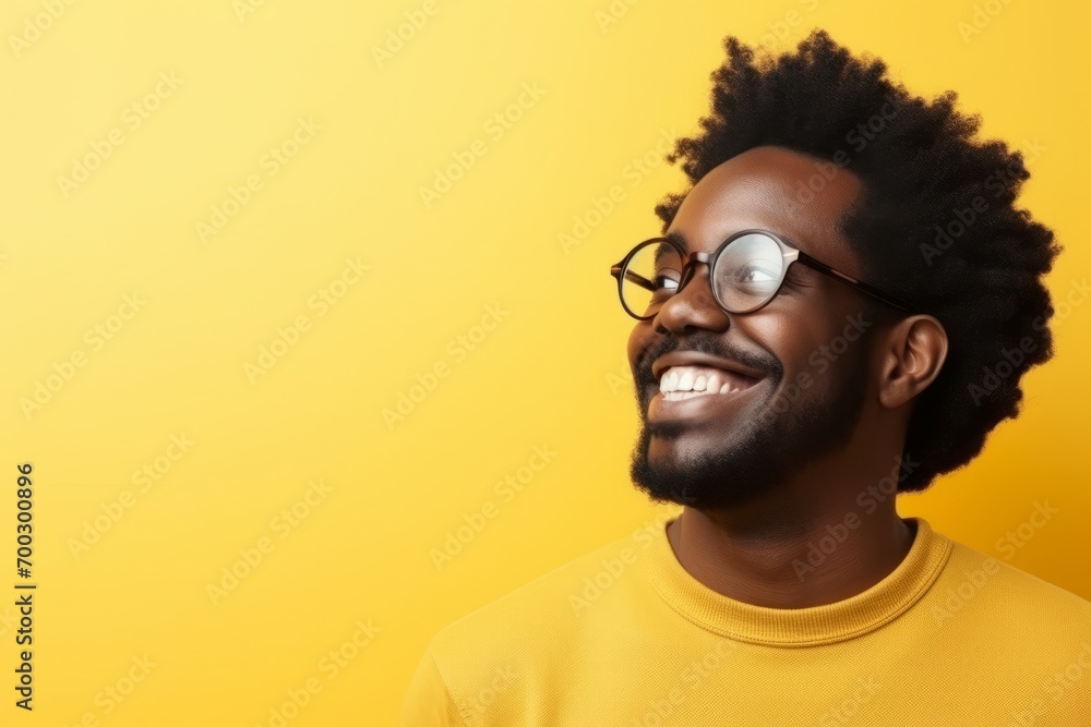 Handsome african american man wearing glasses on yellow background Handsome african american man wearing glasses on yellow background