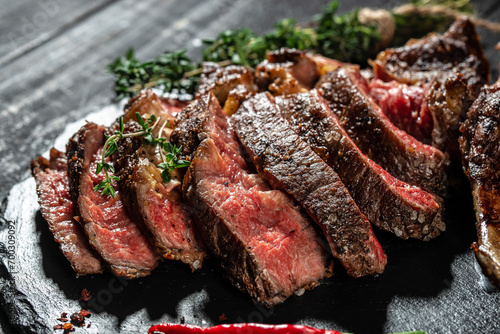Grilled sliced beef steak with red wine. banner, menu, recipe copy space, top view photo