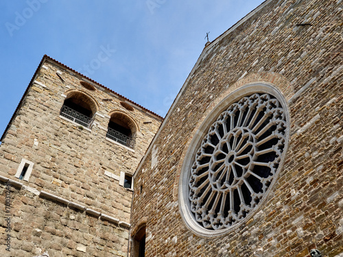 Tower bell and gothic rose window of the romanesque Cathedral of San Giusto (Saint Justus). Trieste, Italy, Europe photo