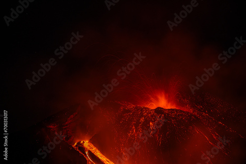 Eruptive vent with lava emis at the top of the Etna volcano photo