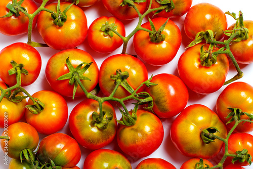 Red tomatoes on a white background  cherry tomatoes