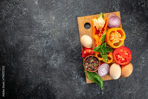 Ingredients for making shakshuka on a wooden board. top view. copy space for text