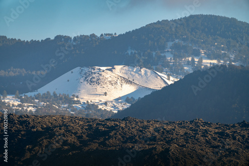 Obraz na płótnie Bronte town under the snowy and majestic volcano Etna and a cloudy blue sky w salonie
