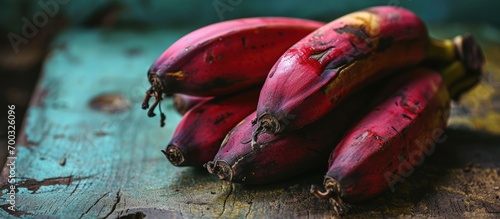 Red bananas are a variant of banana, smaller than Cavendish, with reddish-purple skin, found in Monte Alegre, Para, Brazil. photo