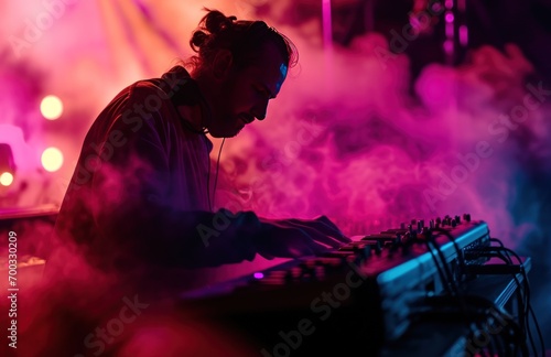 a man is playing music while the smoke from the music equipment