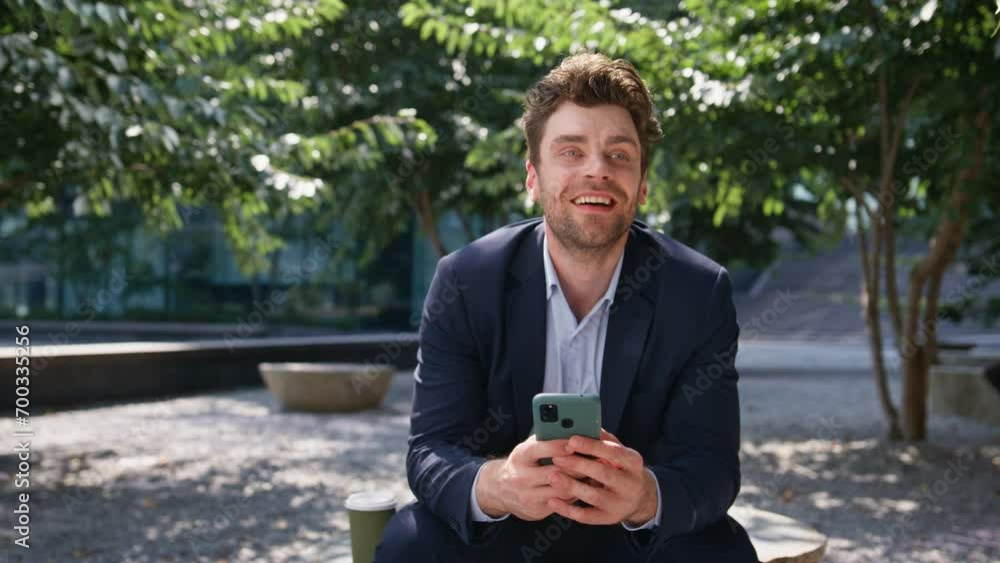 Office manager smiling smartphone reading message at green square close up. Office manager smiling smartphone reading message at green square close up.