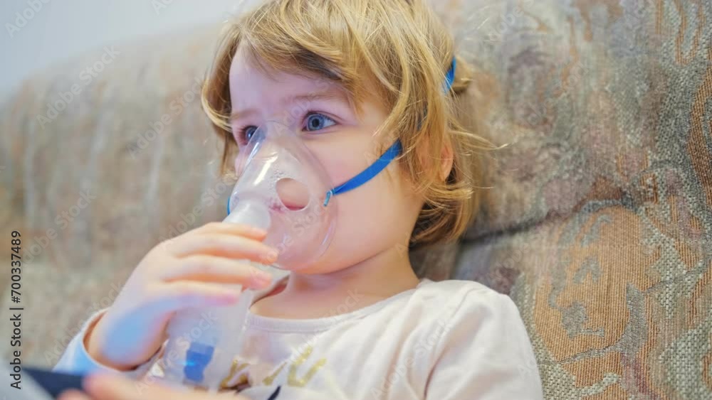 Young Adorable Caucasian Preschooler Girl Wearing Nebulizer Mask Inhaling Cough Medicine Steroid Drug for Respiratory Desease Treatment Young Adorable Caucasian Preschooler Girl Wearing Nebulizer Mask Inhaling Cough Medicine Steroid Drug for Respiratory Desease Treatment