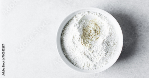 All purpose flour in a ceramic bowl, baking flour in a bowl banner
