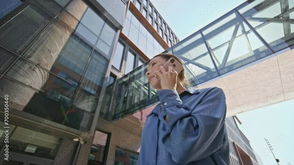 Manager discussing work smartphone standing at modern office building close up. Manager discussing work smartphone standing at modern office building close up.