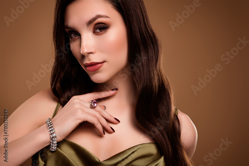 Photo of adorable sweet lady wear silk dress showing expensive jewelry empty space isolated brown color background