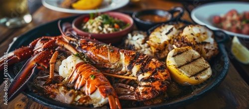 Grilled Puerto Rican seafood plate with sliced Caribbean lobster, following local traditions. photo