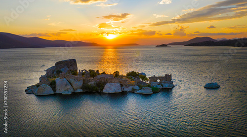 View of Old church building ruins of Heraklia ancient city Bafa Lake of Aegean district at sunset photo