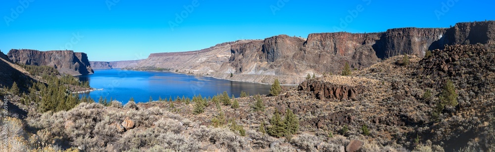 Panorama of the basalt cliffs towering above the Crooked River at Cove Palisades State Park in Oregon, USA