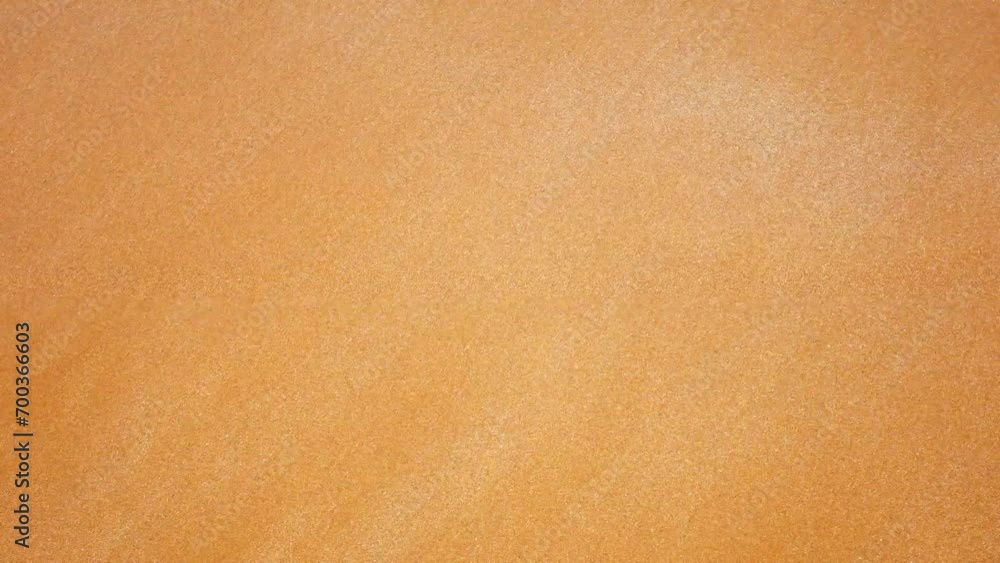 Sea water from the waves runs on the sand. Atlantic Ocean in Morocco. background and detail. Close up of ocean waves rolling onto a beautiful beach sand. Sea water from the waves runs on the sand. Atlantic Ocean in Morocco. background and detail. Close up of ocean waves rolling onto a beautiful beach sand.