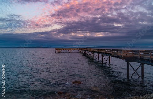 Cloudy Sunset Over A Pier On The Ocean © Lisa