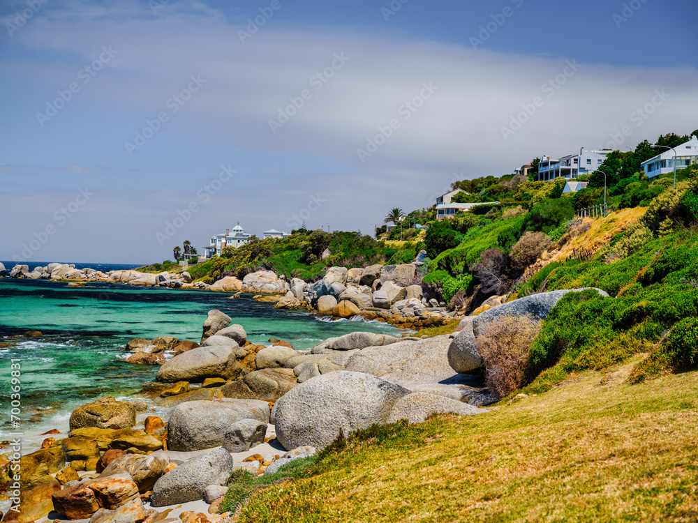 Simon's Town beach and boulders and houses on steep cliff, cape peninsula, Cape Town, South Africa