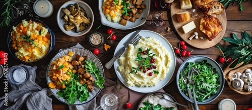 Festive table with baked mashed potatoes, curd cheese, pickled mushrooms. Overhead view. photo