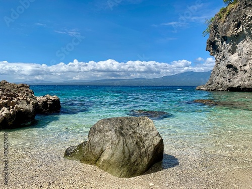 philippines beach clear water and rocks sky clouds