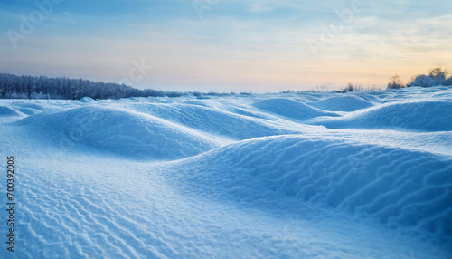 landscape with undulating snowdrifts under serene blue sky, evoking tranquility and seasonal beauty