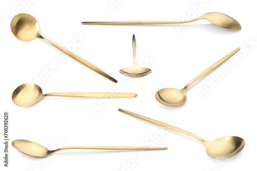 Golden spoon isolated on white, different sides. Kitchen utensil photo