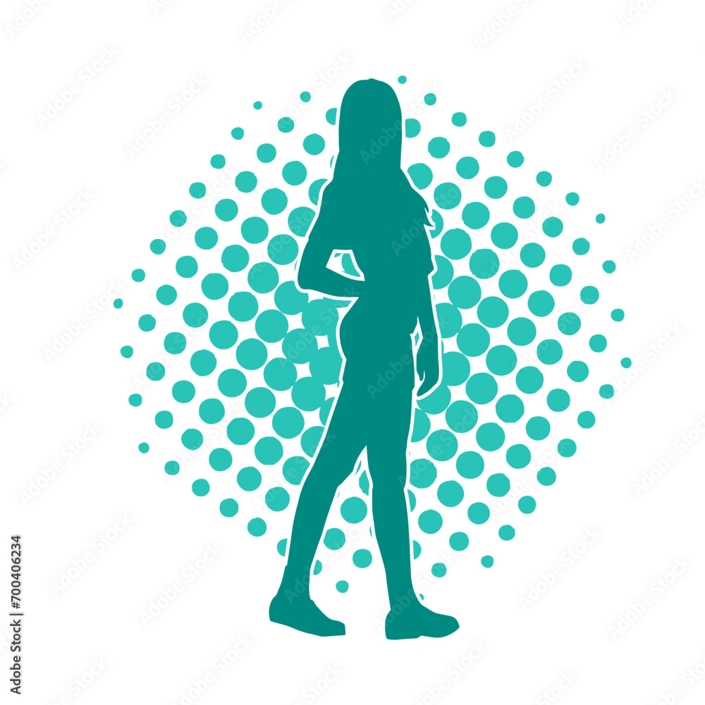 Silhouette of a slim female model wearing casual outfit standing in feminine pose. Silhouette of a slim female model wearing casual outfit standing in feminine pose.