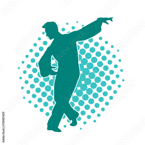 Silhouette of a male dancer in performing pose. Silhouette of a dancing man.