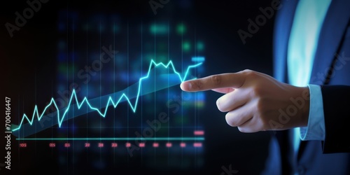 Business success, Businessman pointing finger to growth success finance business chart