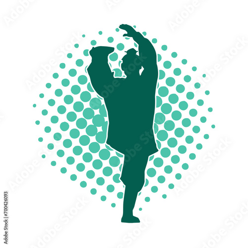 Silhouette of a man in oriental martial art pose. Silhouette of a male in martial art move.