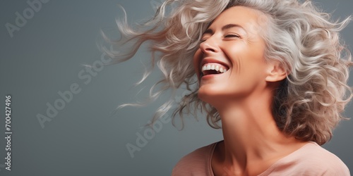 Joyful woman enjoying carefree moment. Positive emotions and beauty.