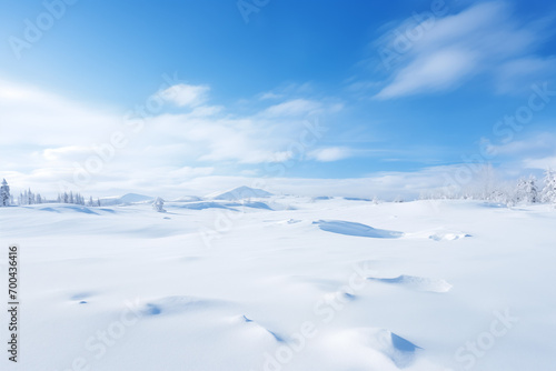 Winter background picture of blue sky, white clouds and blank snow