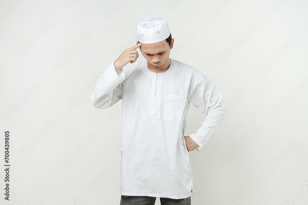 asian muslim man give ponting head gesture. People religious Islam lifestyle concept. celebration Ramadan and ied Mubarak. on isolated background. asian muslim man give ponting head gesture. People religious Islam lifestyle concept. celebration Ramadan and ied Mubarak. on isolated background.