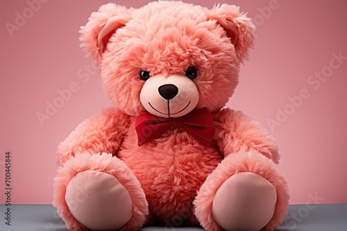 A cute pink teddy bear stuffed toy for kids on pink background © Anjali