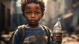 African boy with water bottle