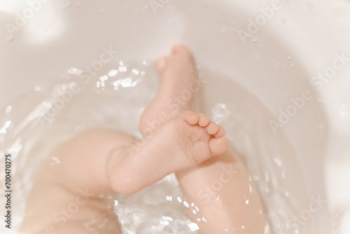 Delicate baby skin, care and bathing, heels photo