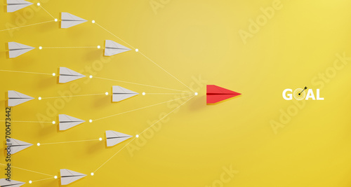 Leadership concept, red leader plane leading white plane, on yellow background. photo