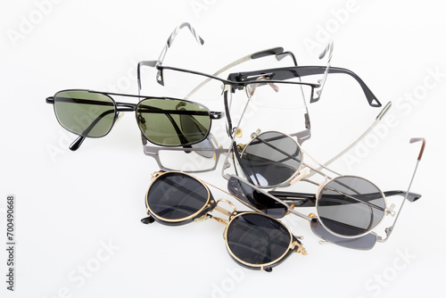 various sunglasses and medical optical glasses isolated on the white background