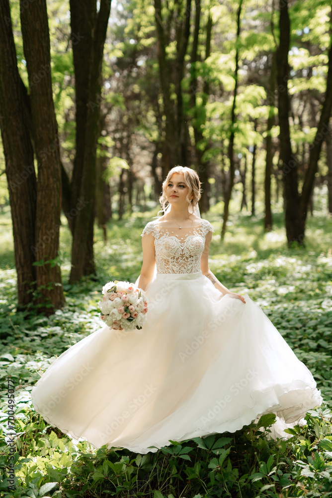 young girl bride in a white dress in a spring forest young girl bride in a white dress in a spring forest