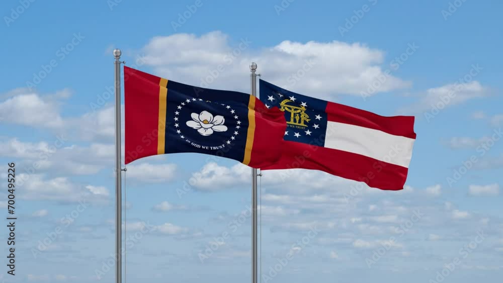 Georgia and Mississippi US state flags waving together on cloudy sky, endless seamless loop Georgia and Mississippi US state flags waving together on cloudy sky, endless seamless loop