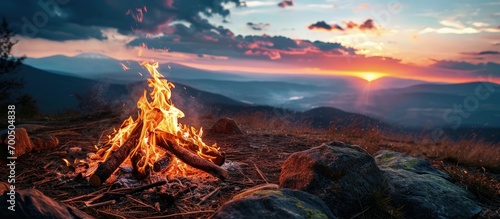 Bonfire on a background of the sky in the mountains. Creative Banner. Copyspace image