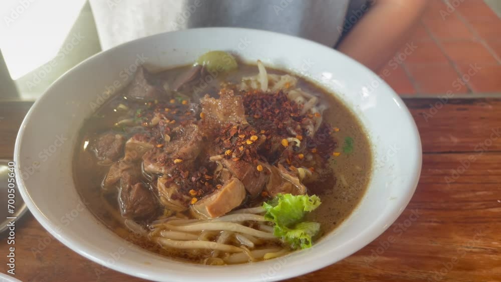 Chicken noodles with chicken feet and chicken wings on soup bowl , stock footage Chicken noodles with chicken feet and chicken wings on soup bowl , stock footage