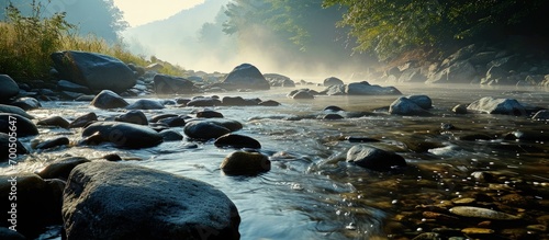 Ilky water drops from rock stream in misty morning in Vermont. Creative Banner. Copyspace image