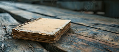 Close up of a vintage memo square paper or notebook on wooden table. Creative Banner. Copyspace image