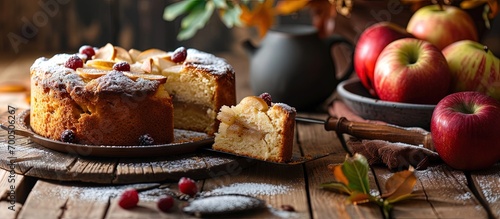 Clasic sponge cake with apples on wood table selective focus Homemade cake. Creative Banner. Copyspace image photo