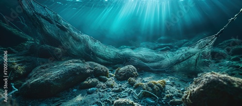 A fishing net underwater fixed on the seabed deep water. Creative Banner. Copyspace image