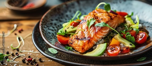 Grilled Atlantic salmon with an avocado and tomato salsa Delicious healthy eating. Creative Banner. Copyspace image photo
